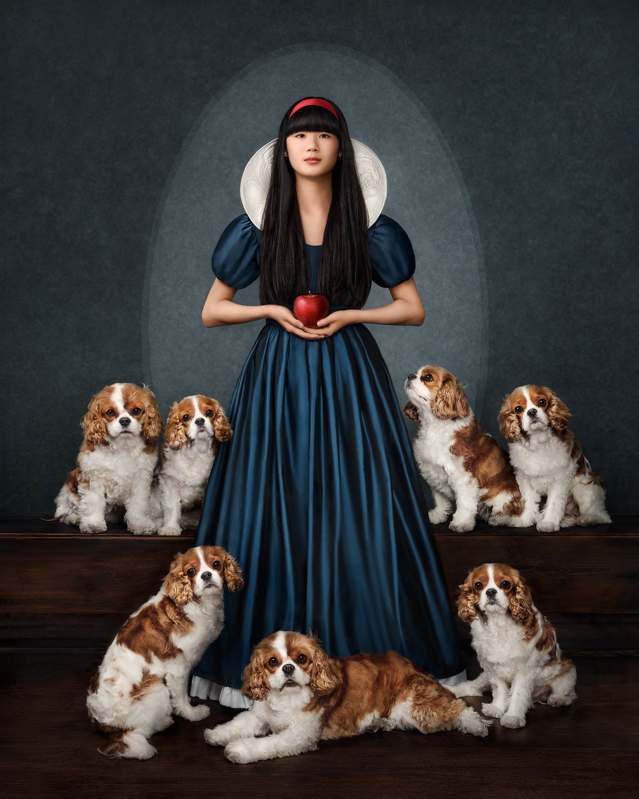 Snow White themed portrait of a patient with Cavalier King Charles spaniels
